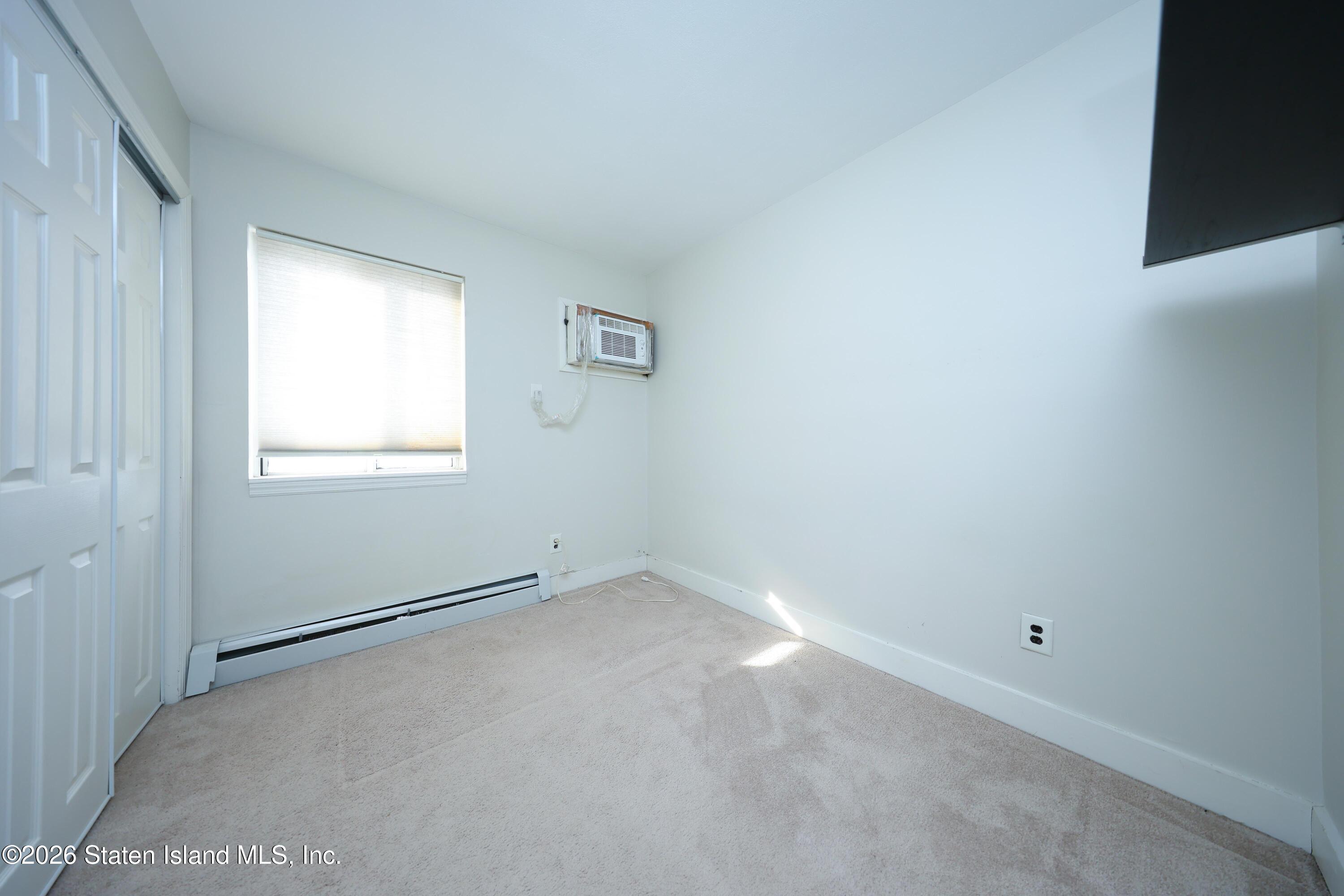 314 Harold Street Staten Island, NY 10314 - Photo 21 of 24 an empty room with a window