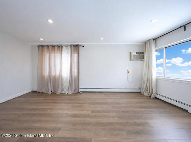 314 Harold Street Staten Island, NY 10314 - Photo 9 of 24 an empty room with wooden floor and windows