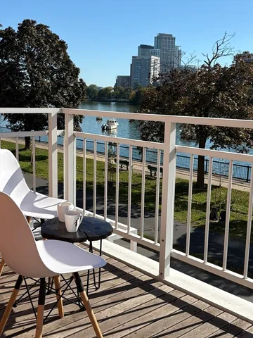 a view of a balcony with chairs