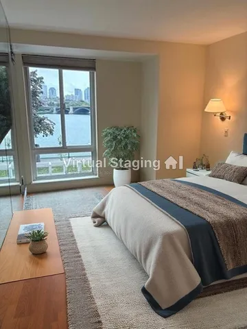 a bedroom with a bed and window