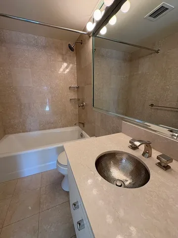 a bathroom with a sink and mirror