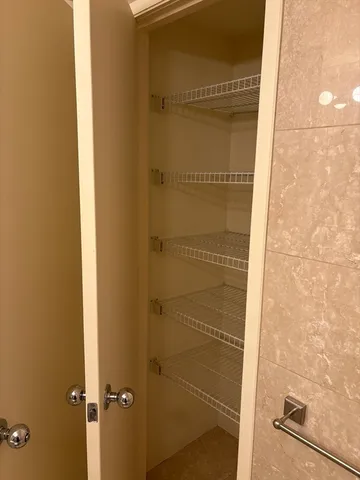 a bathroom with a glass door shower