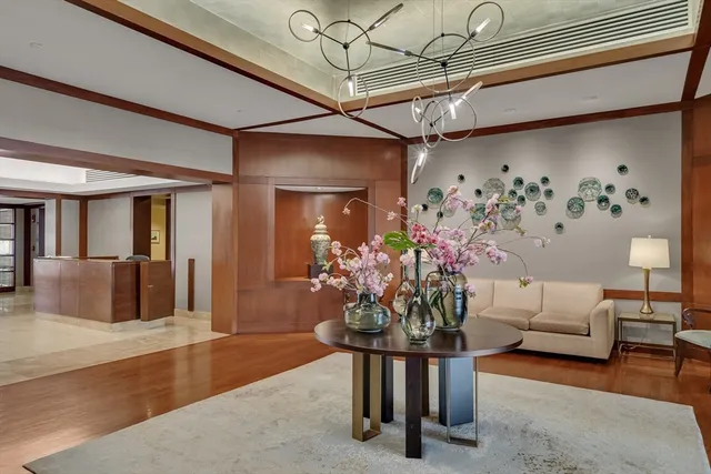 a dining room with furniture and flowers