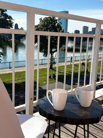 a view of a house with a porch and furniture
