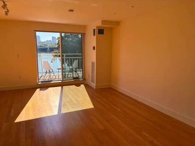 a view of a living room with a large window