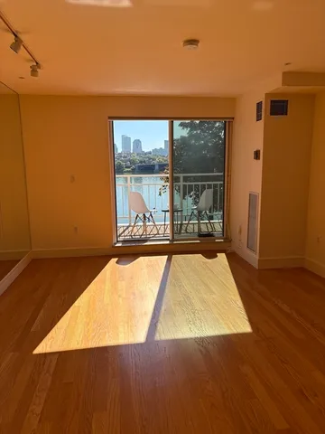 a view of a living room with a large window