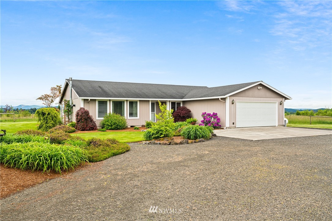 791 Tucker Road Toledo, WA 98591 - Photo 3 of 34 a front view of house with yard and green space