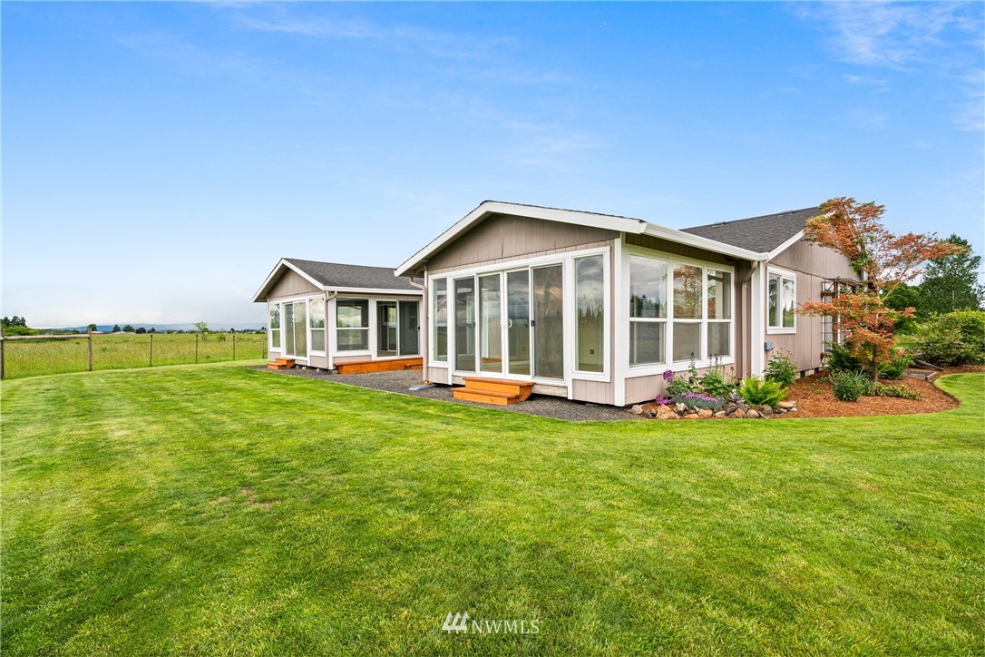 791 Tucker Road Toledo, WA 98591 - Photo 22 of 34 a view of a house with a yard and sitting area