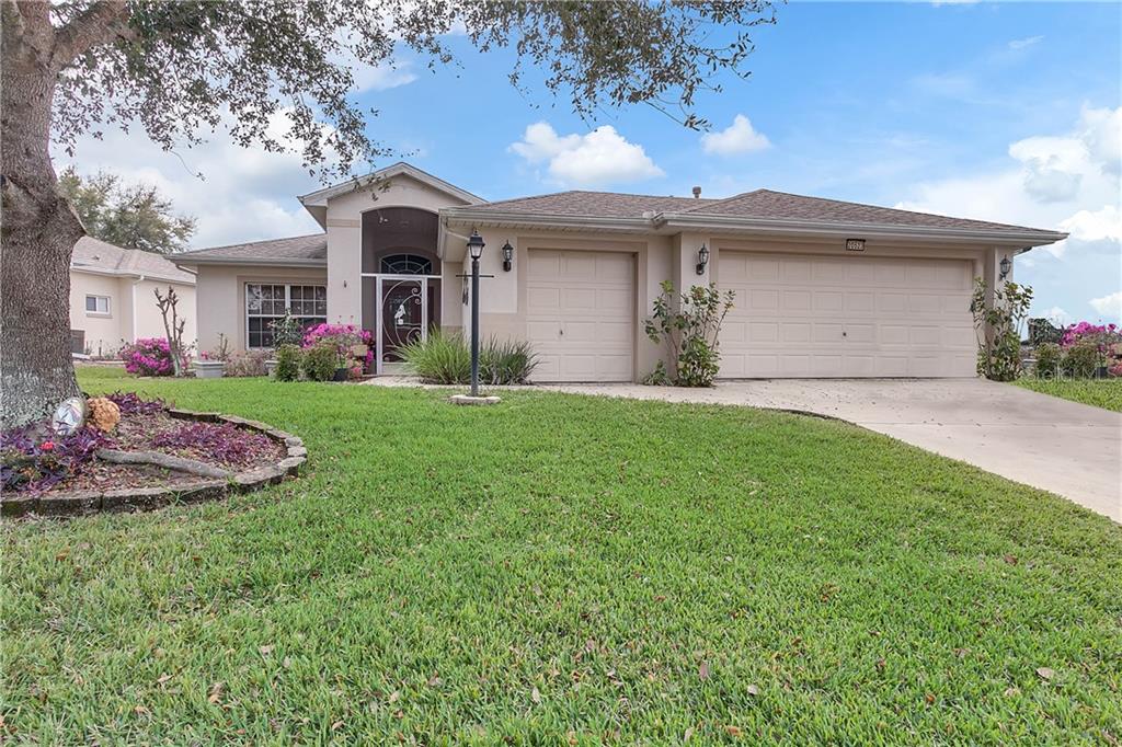 Look at this gorgeous home! Popular York floor plan with a golf cart garage.