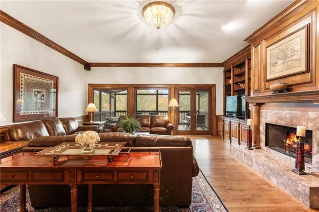 a large white kitchen with sink and refrigerator