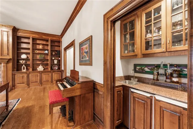 a view of a livingroom with furniture window and wooden floor