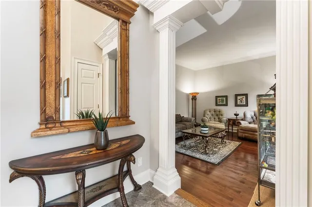 a view of a livingroom with furniture window and wooden floor
