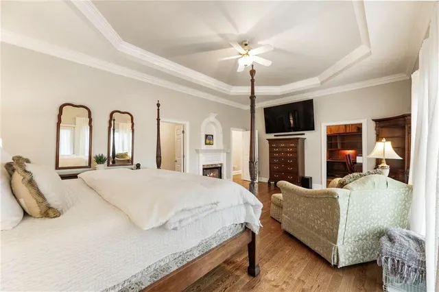 a living room with furniture a couch and a flat screen tv