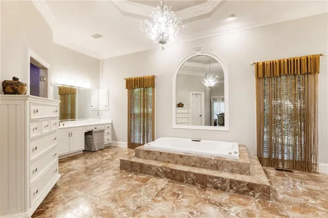 a bedroom with a bed and a table in it