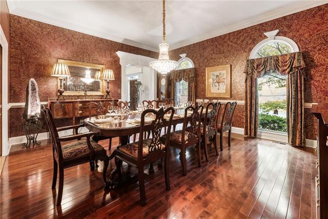 a kitchen with a sink appliances and cabinets