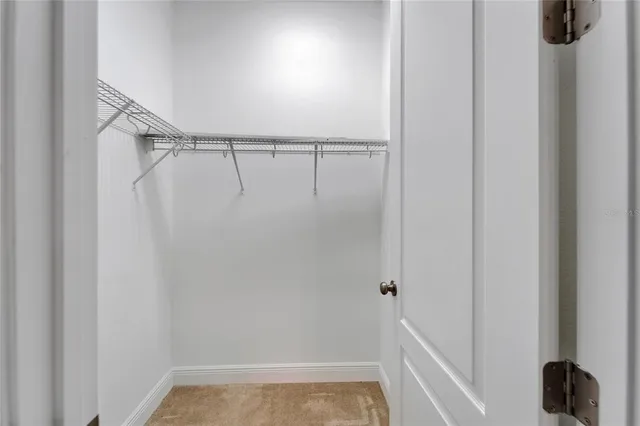 a bathroom with a granite countertop sink a mirror and a shower