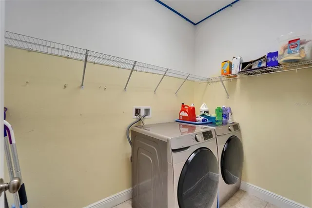 a view of hallway with livingroom and furniture