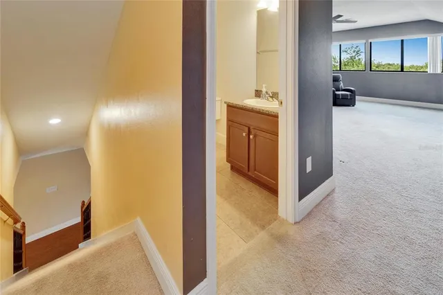 a bedroom with a bed a window and a ceiling fan