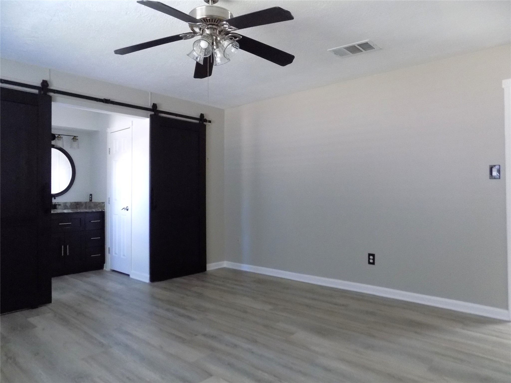 803 Wild Horse Valley Road Katy, TX 77450 - Photo 14 of 26 wooden floor in an empty room