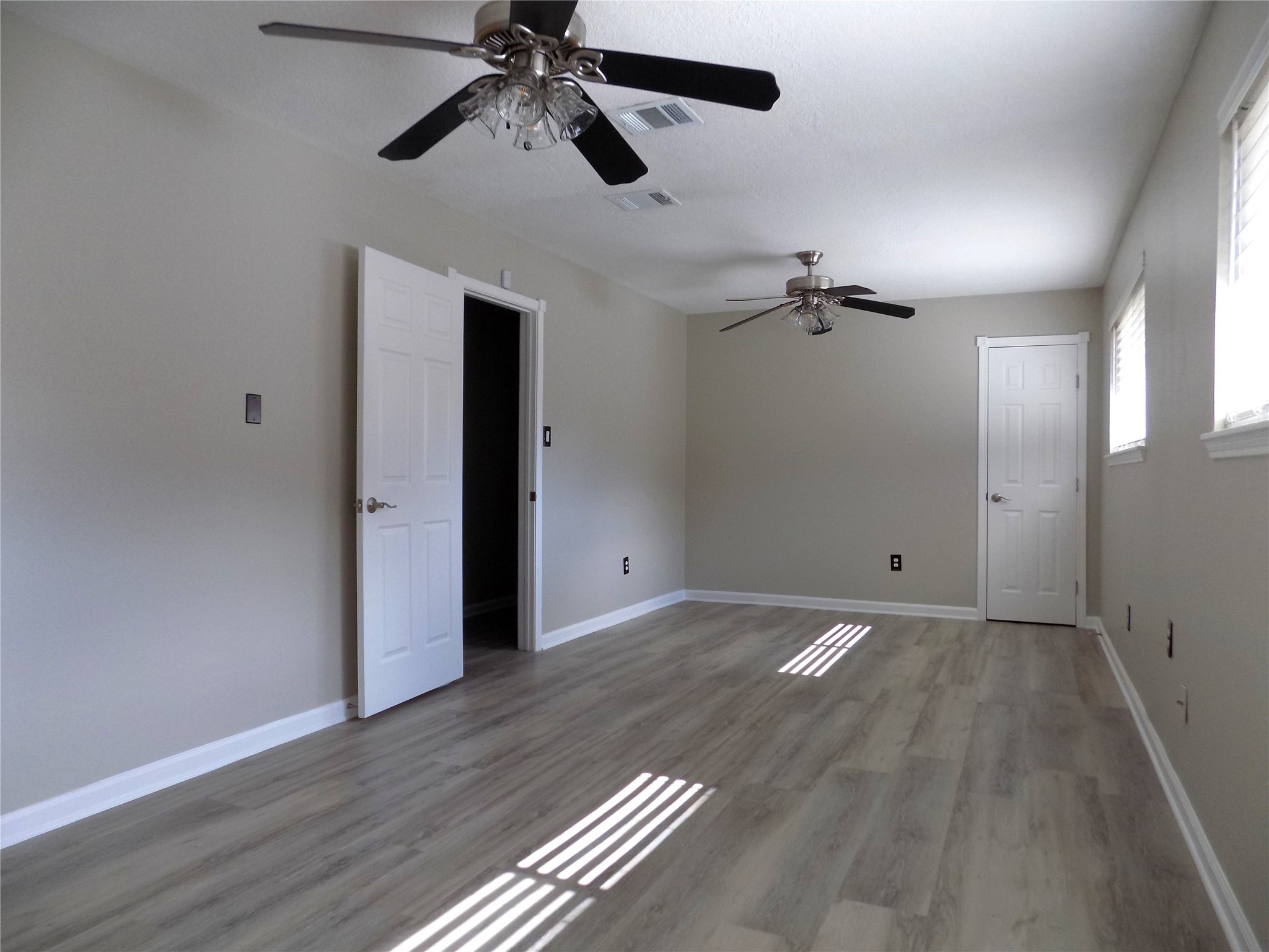 803 Wild Horse Valley Road Katy, TX 77450 - Photo 16 of 26 wooden floor in an empty room