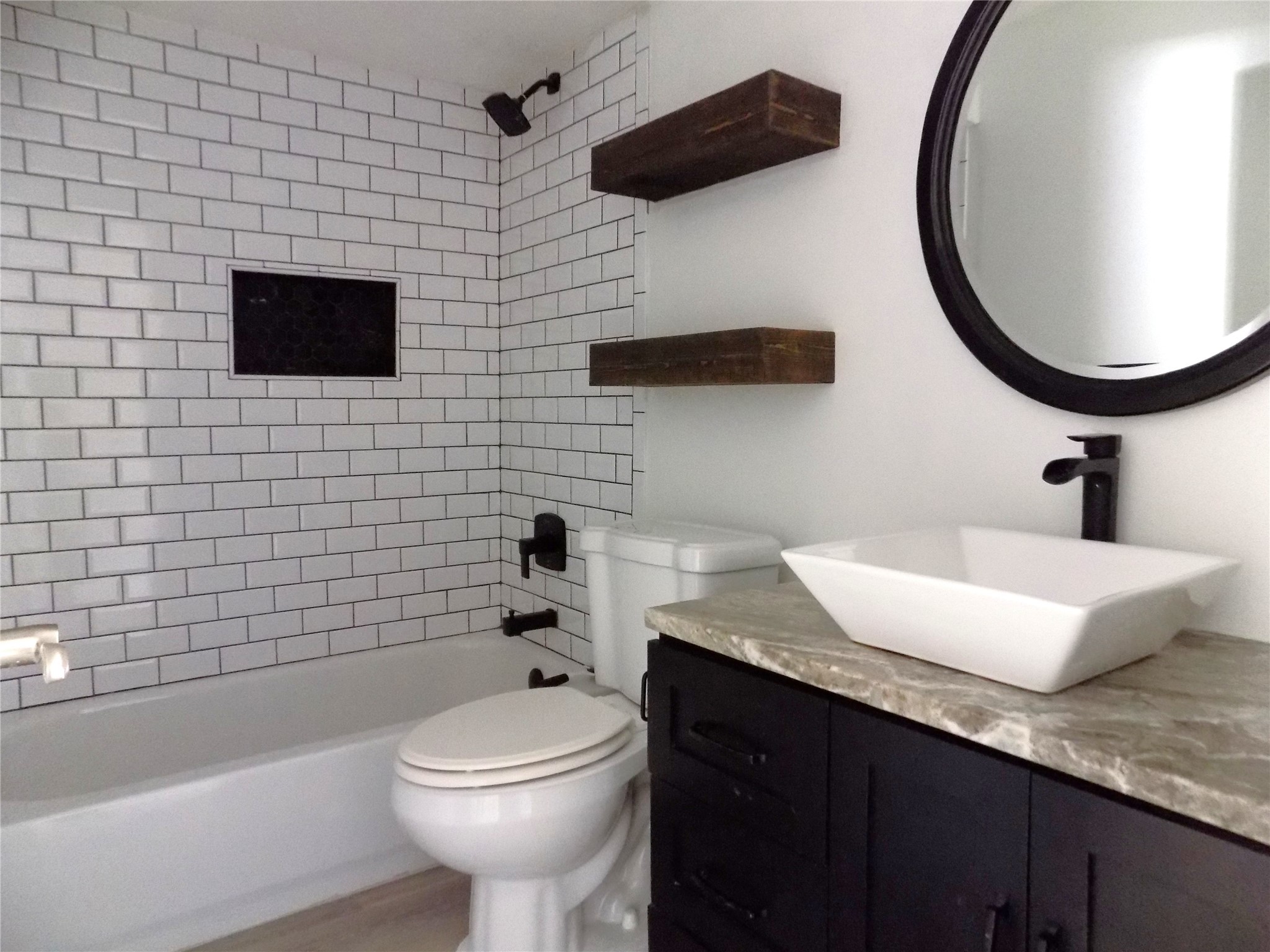 803 Wild Horse Valley Road Katy, TX 77450 - Photo 18 of 26 a bathroom with a sink a toilet and a mirror