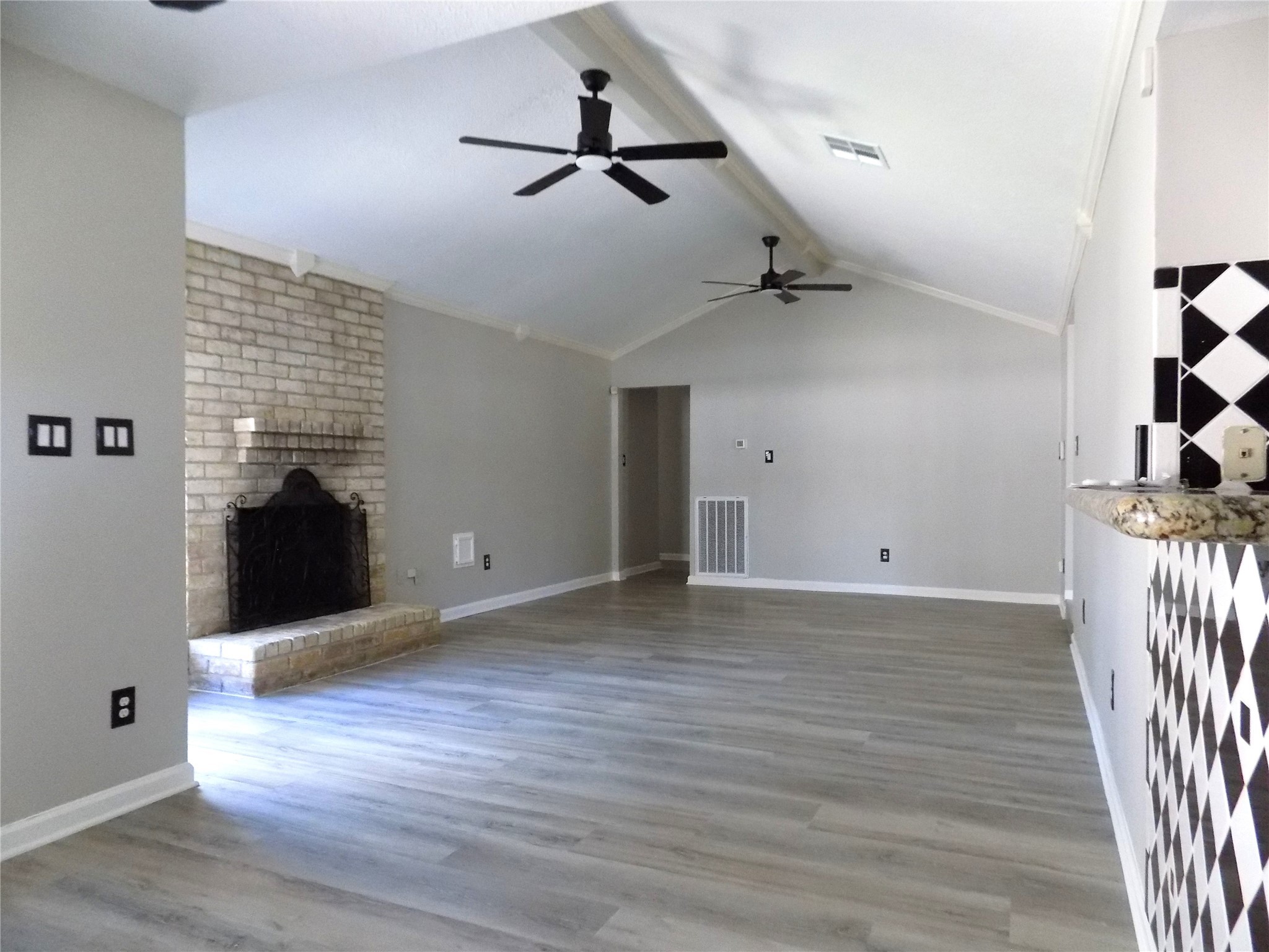 803 Wild Horse Valley Road Katy, TX 77450 - Photo 2 of 26 wooden floor in an empty room with a window