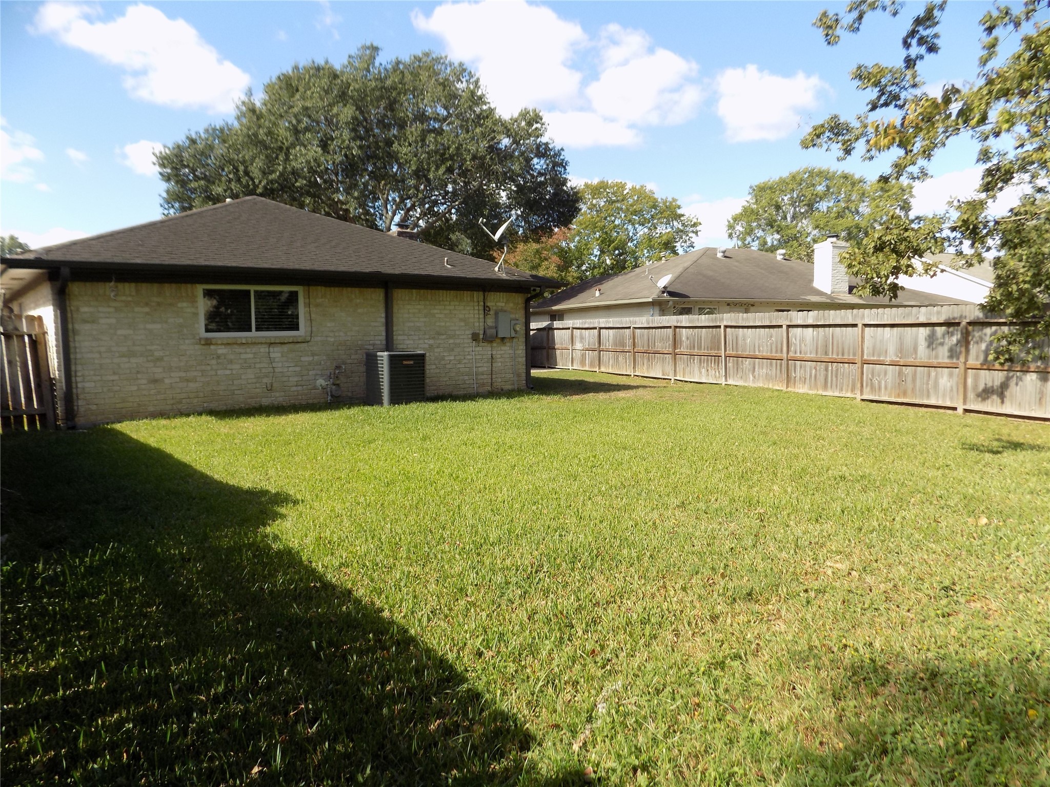 803 Wild Horse Valley Road Katy, TX 77450 - Photo 23 of 26 a front view of a house with a yard