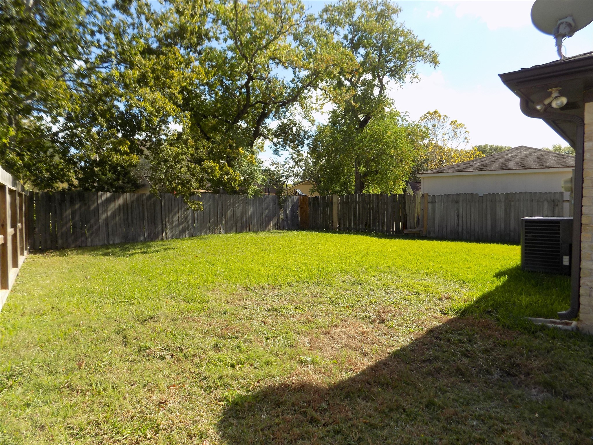 803 Wild Horse Valley Road Katy, TX 77450 - Photo 25 of 26 a view of a swimming pool with a yard