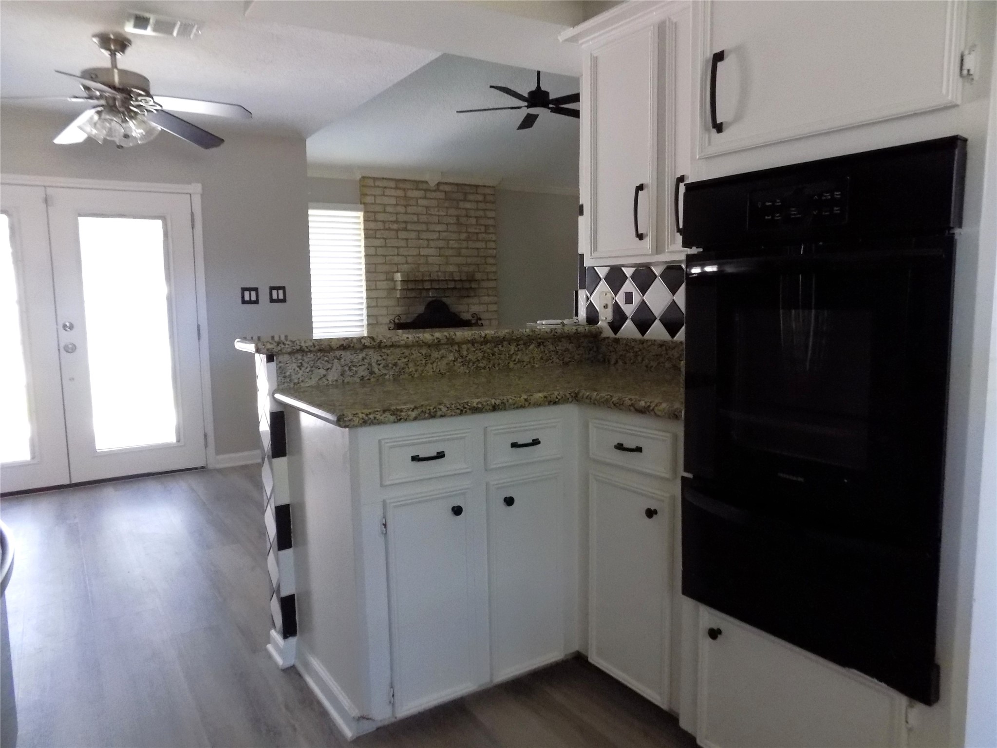 803 Wild Horse Valley Road Katy, TX 77450 - Photo 9 of 26 a kitchen with a refrigerator and a sink