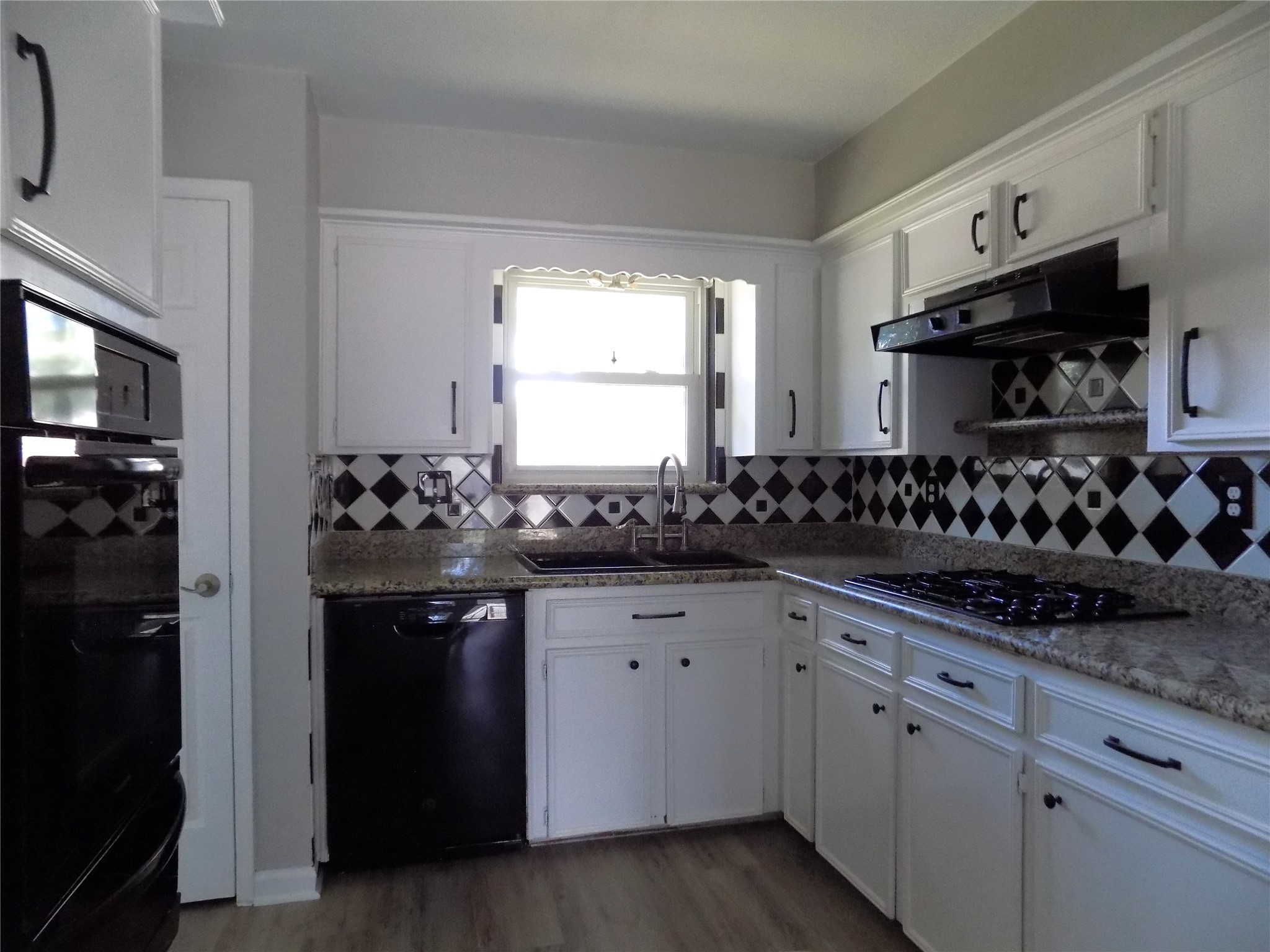 803 Wild Horse Valley Road Katy, TX 77450 - Photo 10 of 26 a kitchen with stainless steel appliances granite countertop a sink and a stove