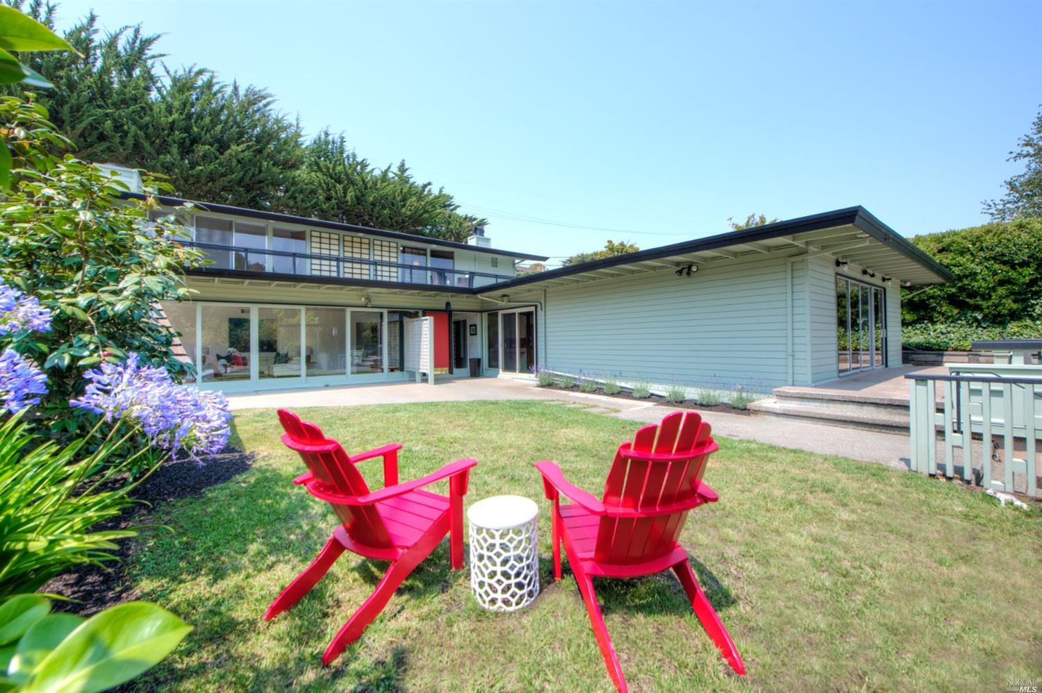 208 Ricardo Road Mill Valley, CA 94941 - Photo 1 of 1 a backyard of a house with table and chairs