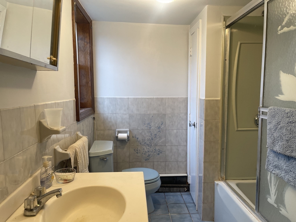 70 Wheaton Avenue Rehoboth, MA 02769 - Photo 16 of 42 a bathroom with a sink and a mirror