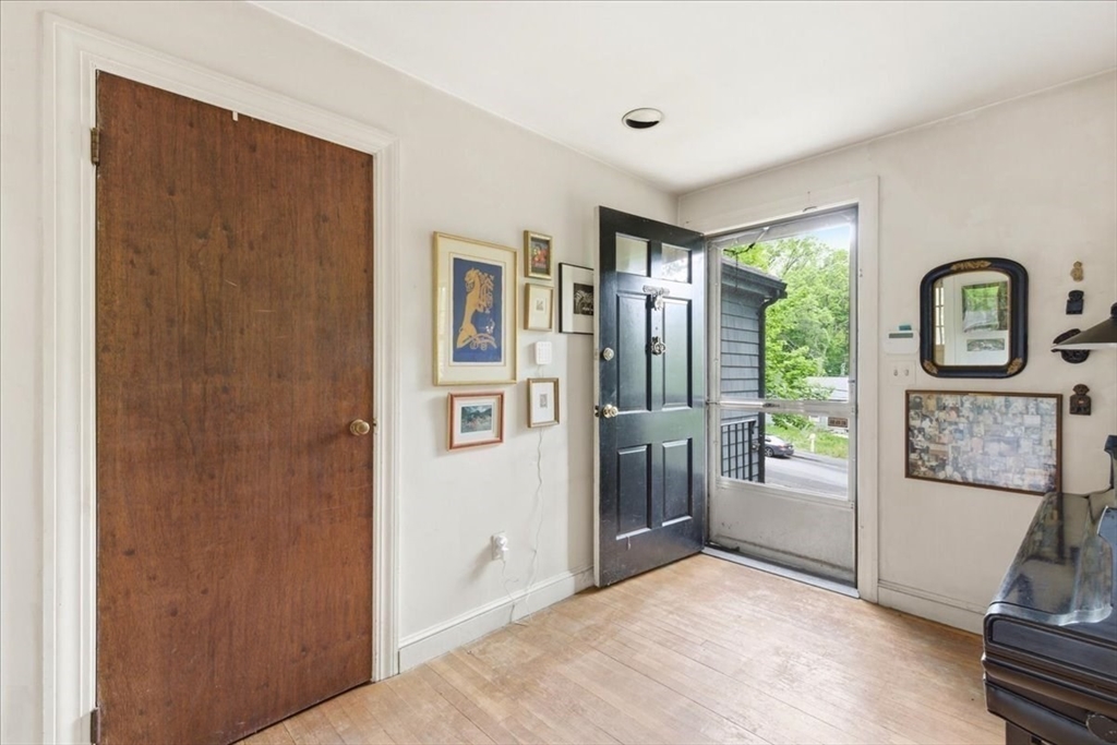 99 Brook Road Sharon, MA 02067 - Photo 7 of 37 a view of a hallway with windows and entryway