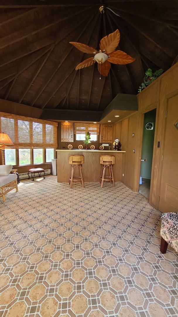 41W898 Beith Road Elburn, IL 60119 - Photo 80 of 82 a view of a patio with a table and chairs under an umbrella