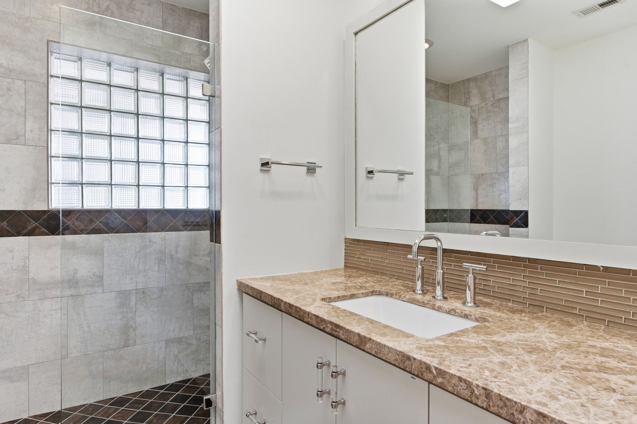 531 Azaleadell Drive Houston, TX 77018 - Photo 24 of 37 a bathroom with a granite countertop sink a mirror and shower