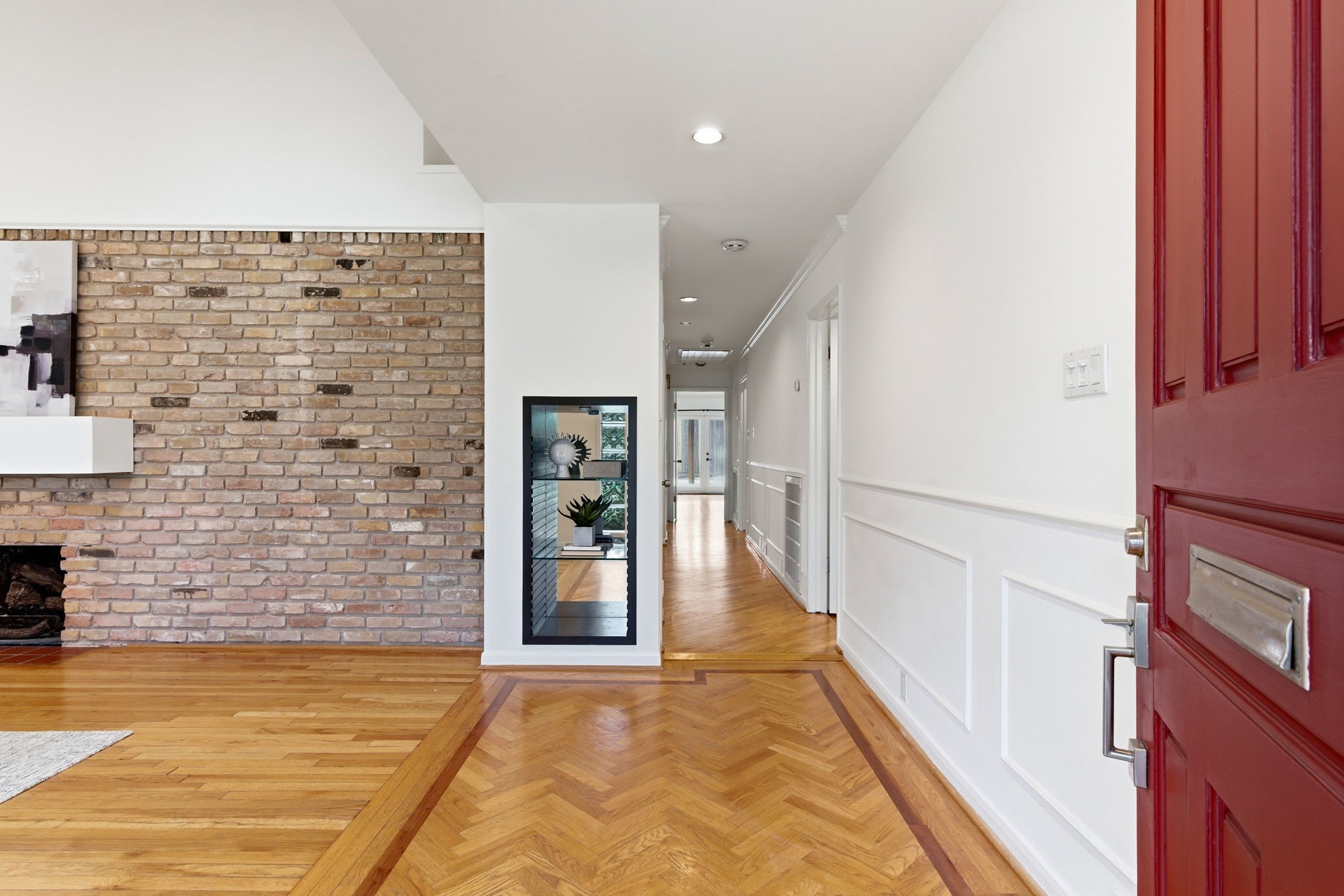531 Azaleadell Drive Houston, TX 77018 - Photo 3 of 37 a view of a hallway with wooden floor and staircase