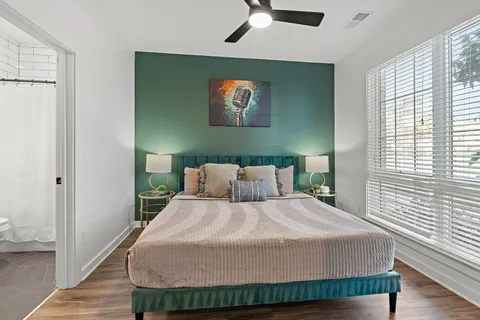 a bedroom with a bed and window