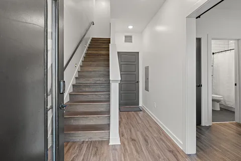 a view of entryway with wooden floor