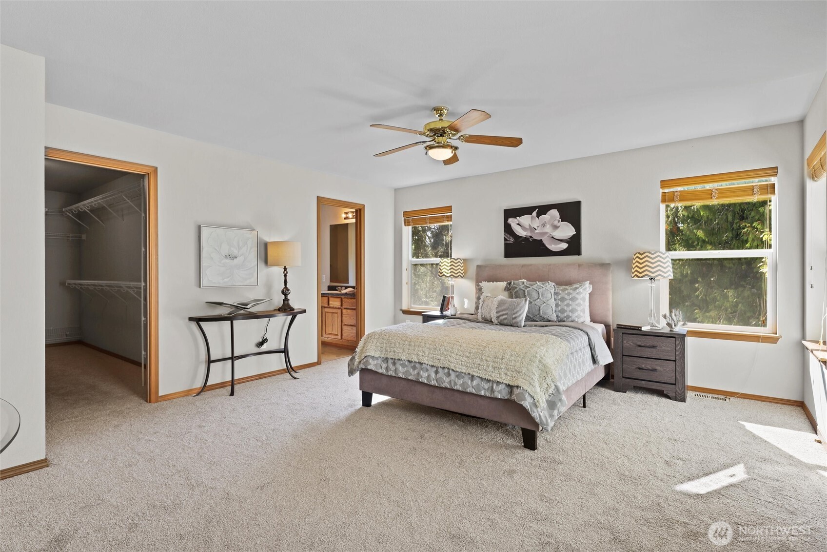 19002 13th Avenue Southeast Bothell, WA 98012 - Photo 18 of 36 a spacious bedroom with a bed a window and painting on the wall