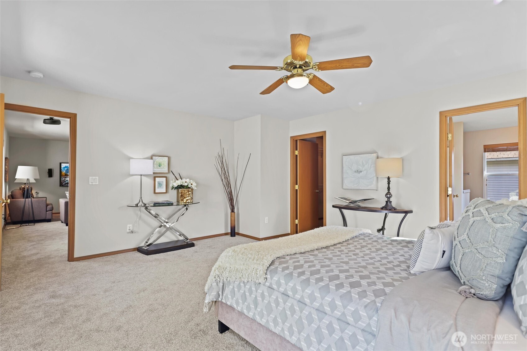 19002 13th Avenue Southeast Bothell, WA 98012 - Photo 19 of 36 a bedroom with a bed and a chandelier