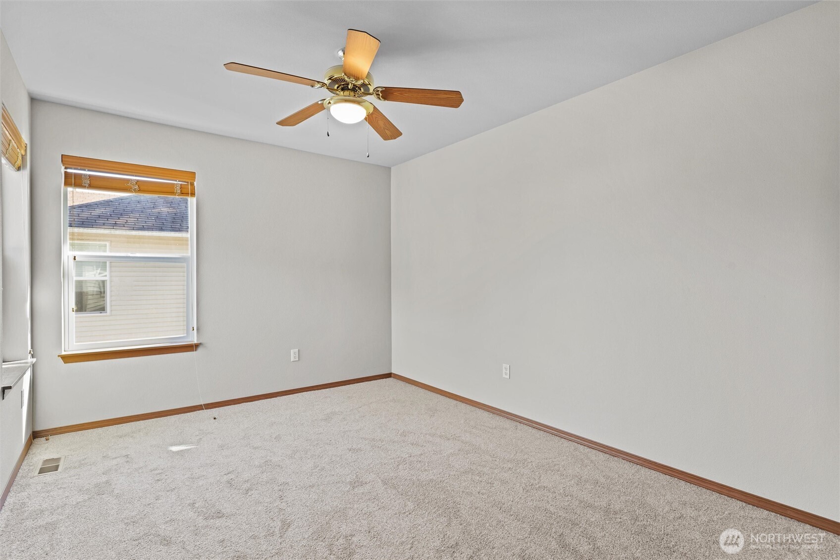 19002 13th Avenue Southeast Bothell, WA 98012 - Photo 27 of 36 an empty room with a window and a fan