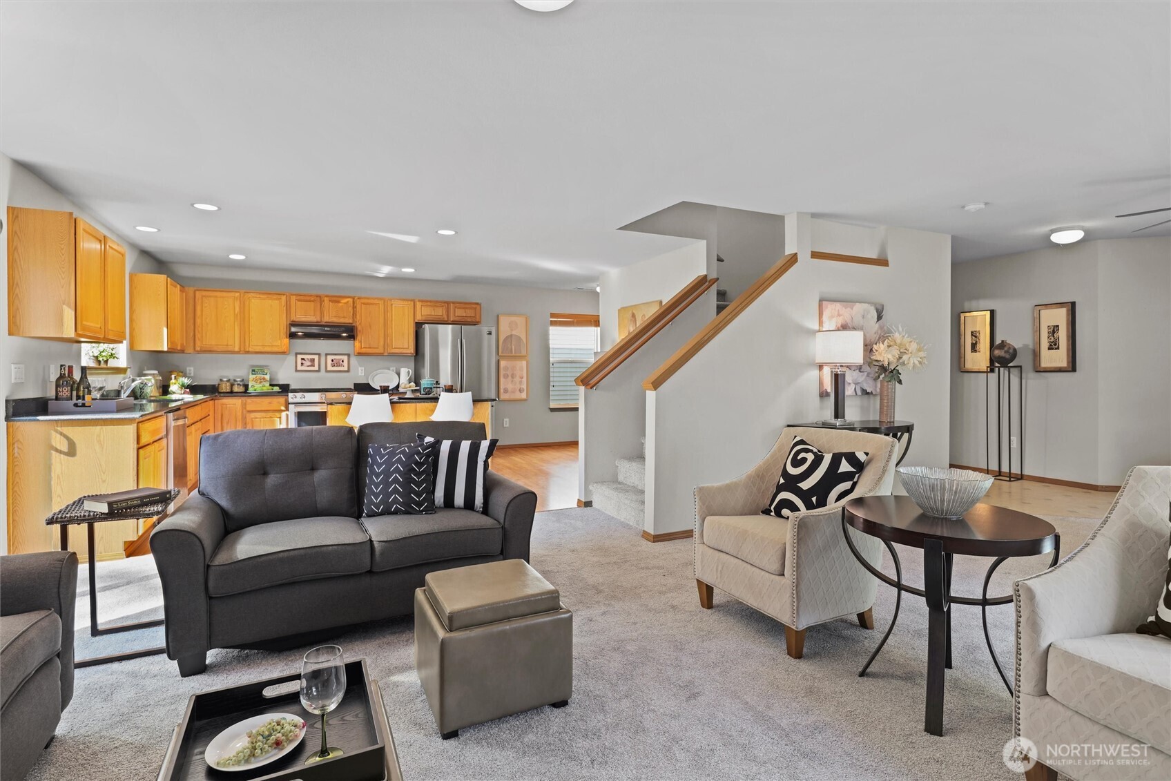 19002 13th Avenue Southeast Bothell, WA 98012 - Photo 6 of 36 a living room with furniture and a view of kitchen
