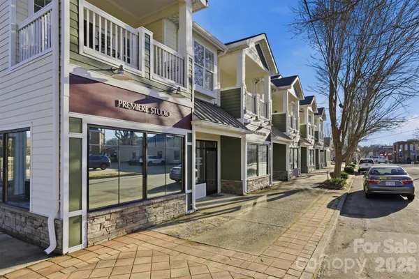 a view of a building with sitting area