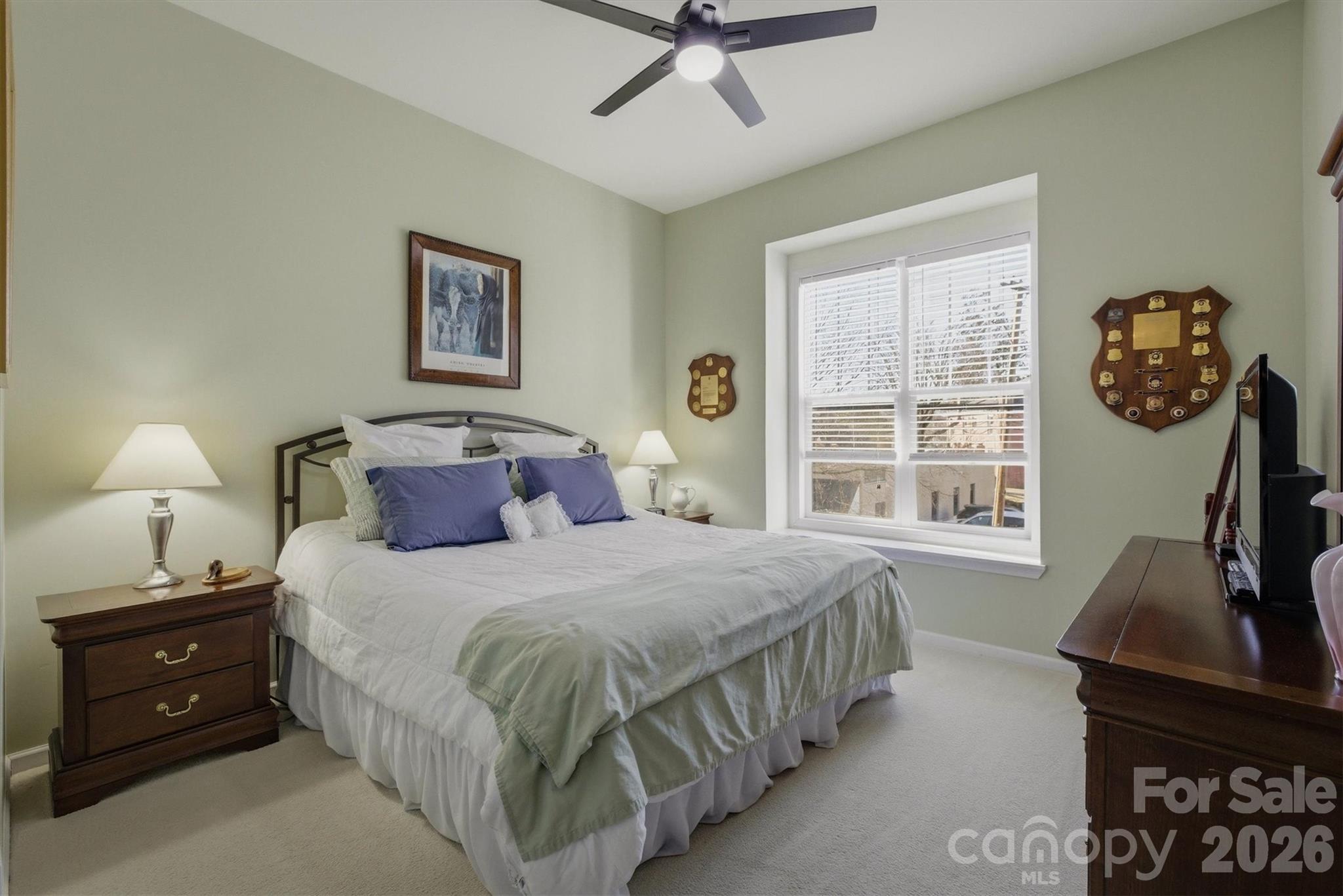 406 East Union Street Morganton, NC 28655 - Photo 11 of 23 a bedroom with a bed and a flat tv screen on the dresser