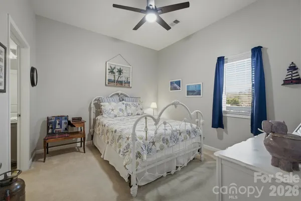 a bedroom with bed and a window