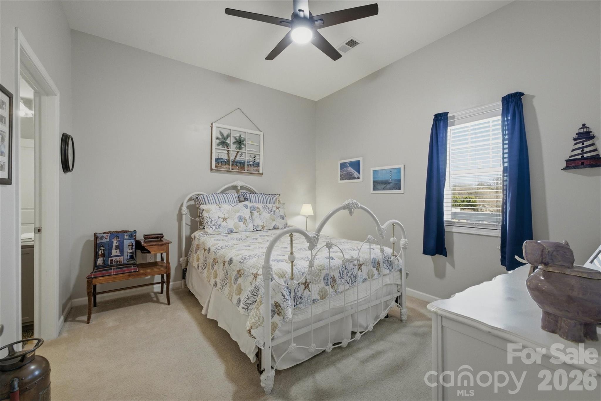 406 East Union Street Morganton, NC 28655 - Photo 14 of 23 a bedroom with bed and a window