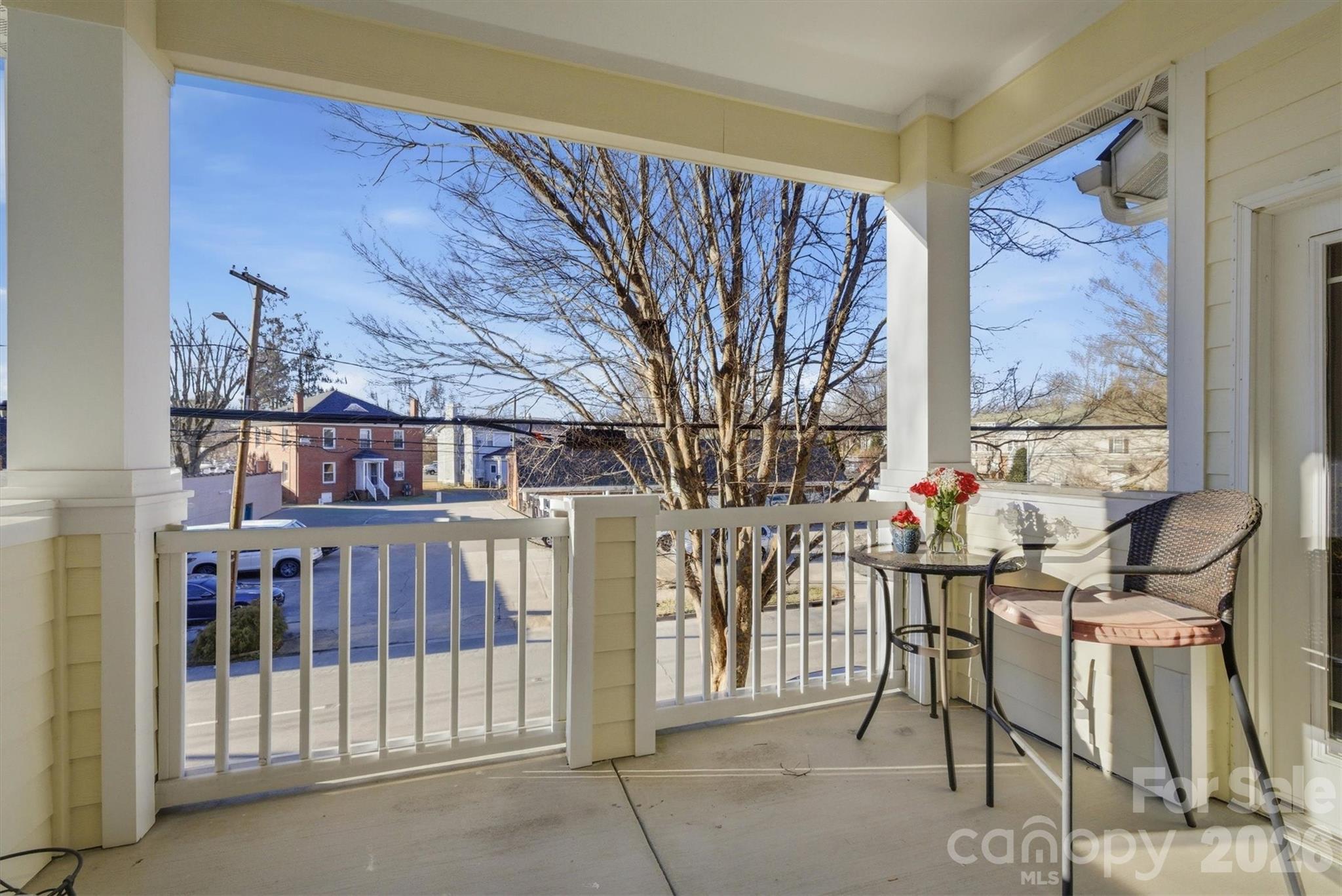 406 East Union Street Morganton, NC 28655 - Photo 19 of 23 a living room with furniture and a book shelf
