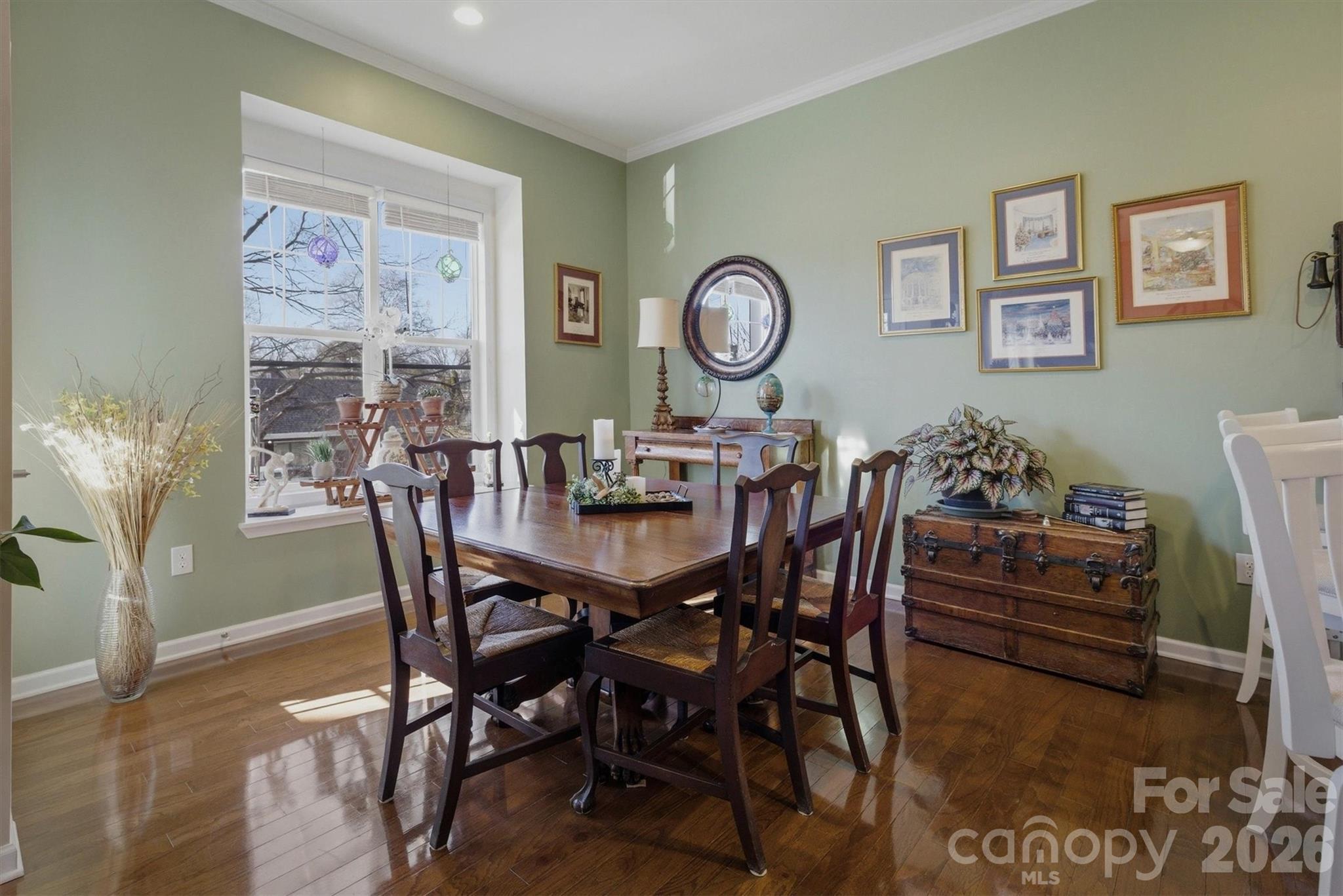 406 East Union Street Morganton, NC 28655 - Photo 7 of 23 a view of a dining room and livingroom with furniture wooden floor and a rug