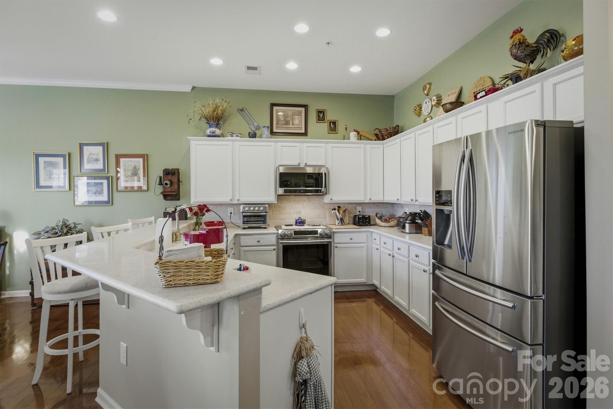 406 East Union Street Morganton, NC 28655 - Photo 9 of 23 a kitchen with a refrigerator and a stove top oven