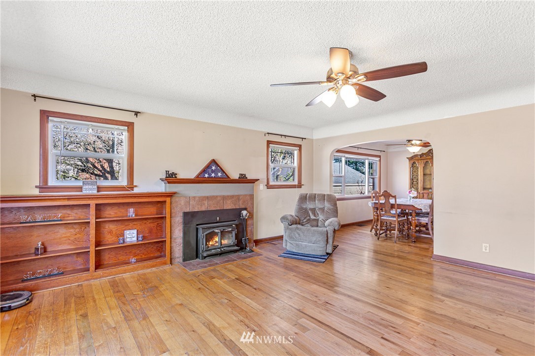 7011 Cady Road Everett, WA 98203 - Photo 19 of 32 a living room with furniture and a fireplace